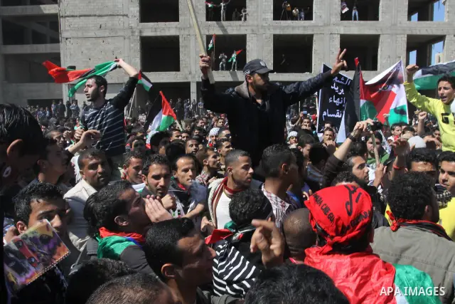 Palestinian Hamas security forces participate with demonstrators in a protest calling for Palestinian political unity between Gaza's Hamas rulers and the Fatah-dominated Palestinian Authority which rules from Ramallah, o...