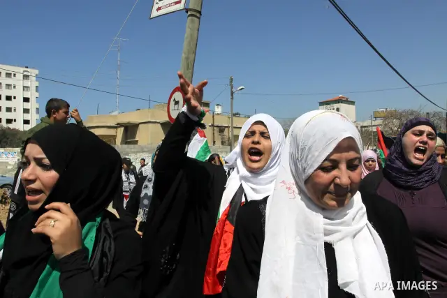 Palestinian demonstrators take part in a protest calling for Palestinian political unity between Gaza's Hamas rulers and the Fatah-dominated Palestinian Authority which rules from Ramallah, on March 15, 2011in Gaza City,...