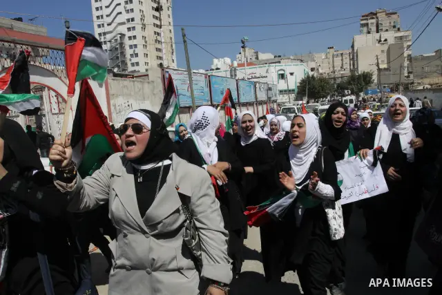 Palestinian demonstrators take part in a protest calling for Palestinian political unity between Gaza's Hamas rulers and the Fatah-dominated Palestinian Authority which rules from Ramallah, on March 15, 2011in Gaza City,...