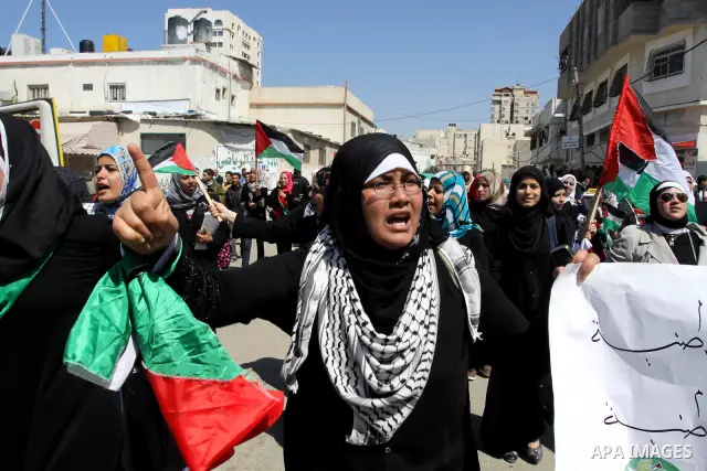 Palestinian demonstrators take part in a protest calling for Palestinian political unity between Gaza's Hamas rulers and the Fatah-dominated Palestinian Authority which rules from Ramallah, on March 15, 2011in Gaza City,...