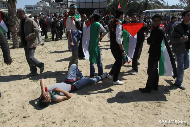 Palestinian demonstrators take part in a protest calling for Palestinian political unity between Gaza's Hamas rulers and the Fatah-dominated Palestinian Authority which rules from Ramallah, on March 15, 2011in Gaza City,...