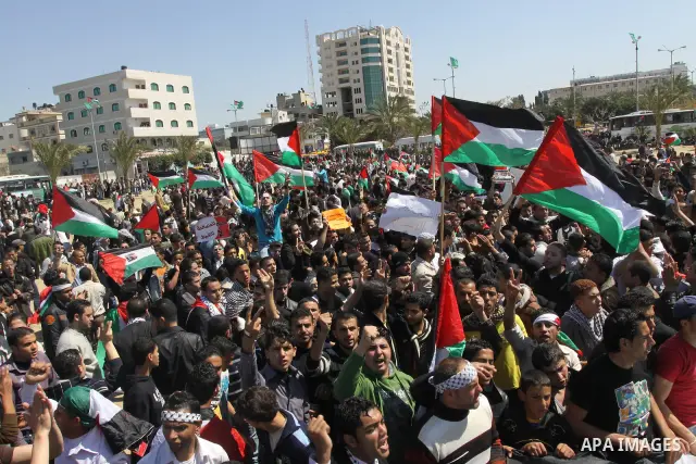 Palestinian demonstrators take part in a protest calling for Palestinian political unity between Gaza's Hamas rulers and the Fatah-dominated Palestinian Authority which rules from Ramallah, on March 15, 2011in Gaza City,...
