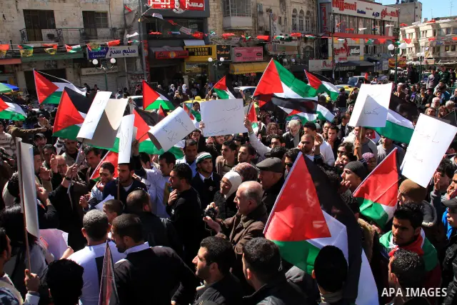 Palestinian demonstrators take part in a protest calling for Palestinian political unity between Gaza's Hamas rulers and the Fatah-dominated Palestinian Authority which rules from Ramallah, on March 15, 2011in Nablus, as...