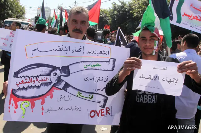 Palestinian demonstrators take part in a protest calling for Palestinian political unity between Gaza's Hamas rulers and the Fatah-dominated Palestinian Authority which rules from Ramallah, on March 15, 2011in Gaza City,...