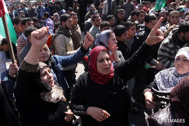Palestinian demonstrators take part in a protest calling for Palestinian political unity between Gaza's Hamas rulers and the Fatah-dominated Palestinian Authority which rules from Ramallah, on March 15, 2011in Gaza City,...