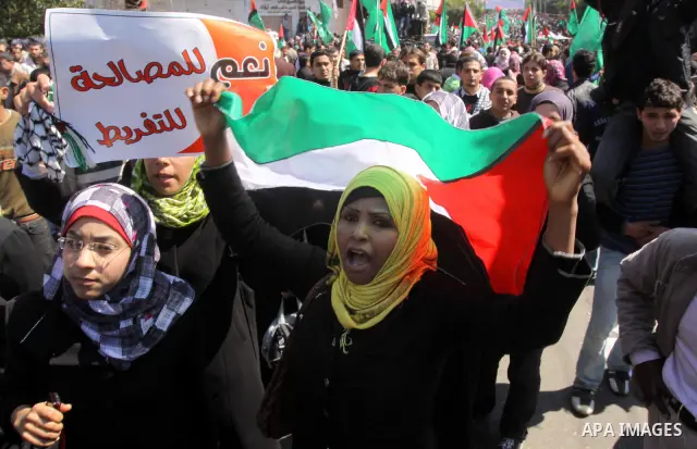 Palestinian demonstrators take part in a protest calling for Palestinian political unity between Gaza's Hamas rulers and the Fatah-dominated Palestinian Authority which rules from Ramallah, on March 15, 2011in Gaza City,...