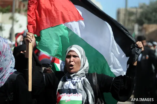 Palestinian demonstrators take part in a protest calling for Palestinian political unity between Gaza's Hamas rulers and the Fatah-dominated Palestinian Authority which rules from Ramallah, on March 15, 2011in Gaza City,...