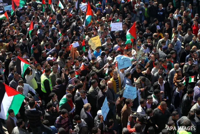 Palestinian demonstrators take part in a protest calling for Palestinian political unity between Gaza's Hamas rulers and the Fatah-dominated Palestinian Authority which rules from Ramallah, on March 15, 2011in Gaza City,...