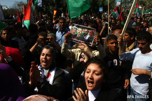Palestinian demonstrators take part in a protest calling for Palestinian political unity between Gaza's Hamas rulers and the Fatah-dominated Palestinian Authority which rules from Ramallah, on March 15, 2011in Gaza City,...