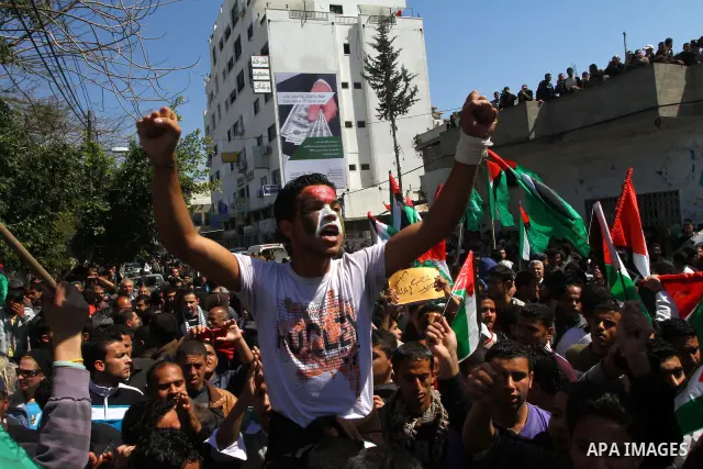 Palestinian demonstrators take part in a protest calling for Palestinian political unity between Gaza's Hamas rulers and the Fatah-dominated Palestinian Authority which rules from Ramallah, on March 15, 2011in Gaza City,...