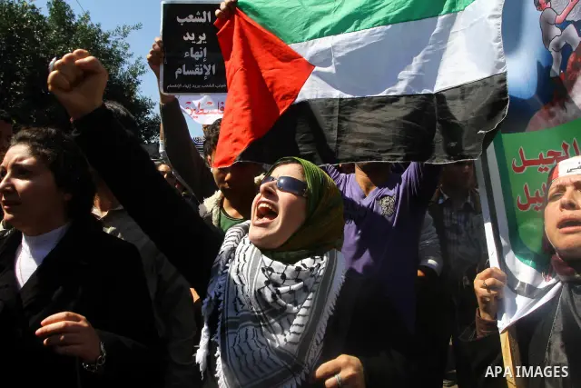 Palestinian demonstrators take part in a protest calling for Palestinian political unity between Gaza's Hamas rulers and the Fatah-dominated Palestinian Authority which rules from Ramallah, on March 15, 2011in Gaza City,...