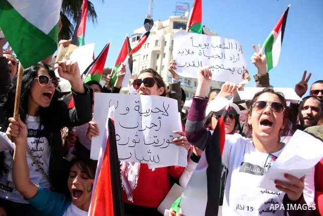 Palestinian demonstrators take part in a protest calling for Palestinian political unity between Gaza's Hamas rulers and the Fatah-dominated Palestinian Authority which rules from Ramallah, on March 15, 2011 in Ramallah,...