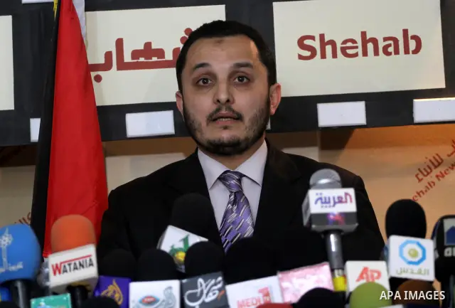 The spokesman of Interior Ministry, Ehab al-Ghousaen speaks to media following the protests calling for Palestinian political unity between Gaza's Hamas rulers and the Fatah-dominated Palestinian Authority which rules fr...