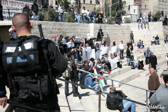 Palestinian demonstrators take part in a protest calling for Palestinian political unity between Gaza's Hamas rulers and the Fatah-dominated Palestinian Authority which rules from Ramallah, on March 15, 2011 in front of...