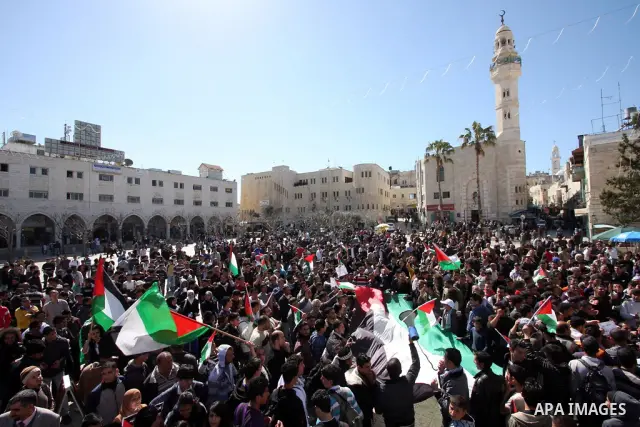 Palestinian demonstrators take part in a protest calling for Palestinian political unity between Gaza's Hamas rulers and the Fatah-dominated Palestinian Authority which rules from Ramallah, on March 15, 2011 in Bethlehem...