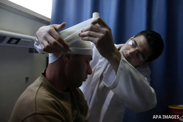 Palestinian Sami Snuber 31 receives medical treatment at a hospital in Ramallah, West Bank, on March 17, 2011. Snuber apparently was attacked by sticks and hit on his head by Israeli settlers from the West Bank settlemen...