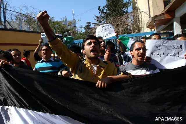 Palestinian youths participate in a sit-in calling for national reconciliation in front of the United Nations Relief and Works Agency (UNRWA) headquarters in Gaza City, March 17, 2011. Photo by Ashraf Amra