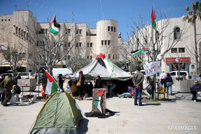 Palestinian students camping in the courtyard of the Nativity in Bethlehem, calling for national Palestinian reconciliation on17 March 2011.Photo by Sliman Khader..