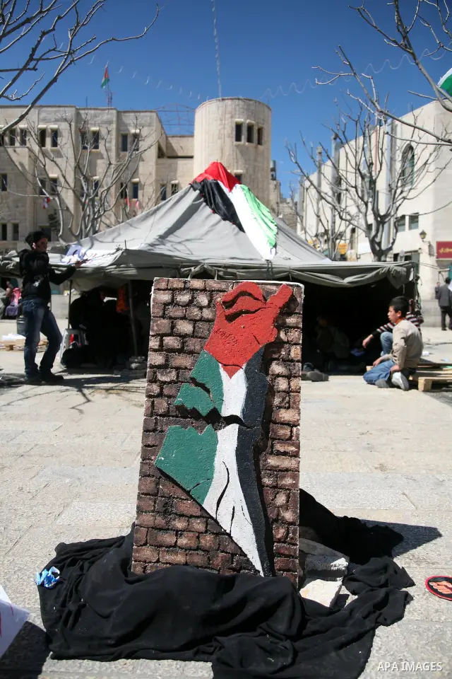 Palestinian students camping in the courtyard of the Nativity in Bethlehem, calling for national Palestinian reconciliation on17 March 2011.Photo by Sliman Khader..