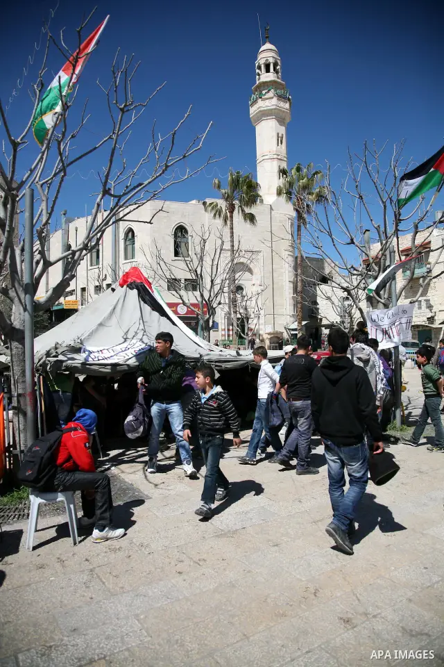 Palestinian students camping in the courtyard of the Nativity in Bethlehem, calling for national Palestinian reconciliation on17 March 2011.Photo by Sliman Khader..