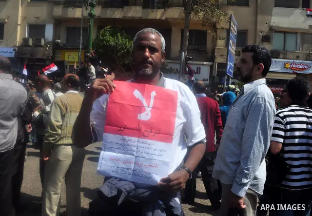 Egyptians shout anti- constitutional amendments slogans during a protest at Tahrir Square in Cairo, Egypt, Friday, March 18, 2011 a day before the referendum . Civic groups have raised fears that the timing of a Saturday...