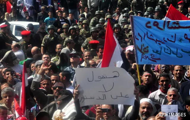 Egyptians shout anti- constitutional amendments slogans during a protest at Tahrir Square in Cairo, Egypt, Friday, March 18, 2011 a day before the referendum . Civic groups have raised fears that the timing of a Saturday...