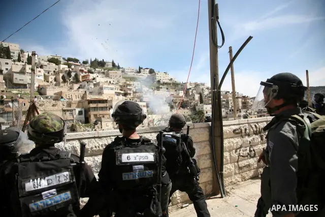 Israeli soldiers fire tear gas canisters towards Palestinian demonstrators during the clashes after Friday prayers in Jerusalem's neighbourhood of silwan on March 18, 2011. Photo by Sliman Khader