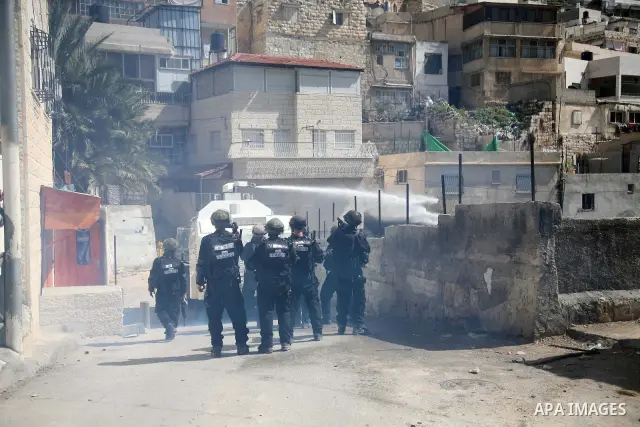Israeli soldiers fire tear gas canisters towards Palestinian demonstrators during the clashes after Friday prayers in Jerusalem's neighbourhood of silwan on March 18, 2011. Photo by Sliman Khader