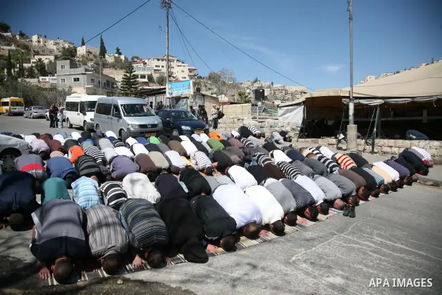 Palestinian demonstrators attend Friday prayers at the protest tent in Jerusalem's neighbourhood of silwan on March 18, 2011. Photo by Sliman Khader