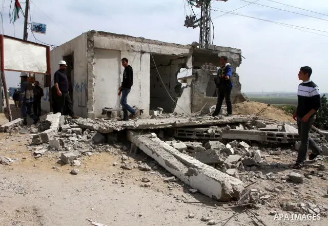 Palestinian looks at the damage after Israeli strikes on the Gaza Strip. Israeli strikes on the Gaza Strip wounded five Hamas security officers and a boy on Saturday after militants launched mortar bombs into Israel, lig...