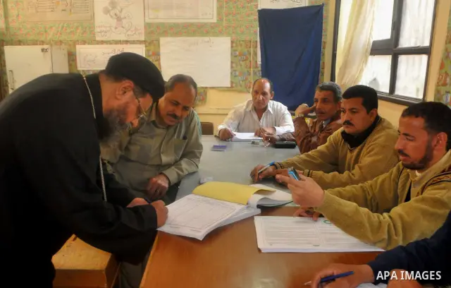 Egyptians cast their vote during a national referendum, at a school in Cairo. Egyptians flocked to the polls on Saturday in a historic referendum on changes to the constitution. The amendments were proposed by a judicial...