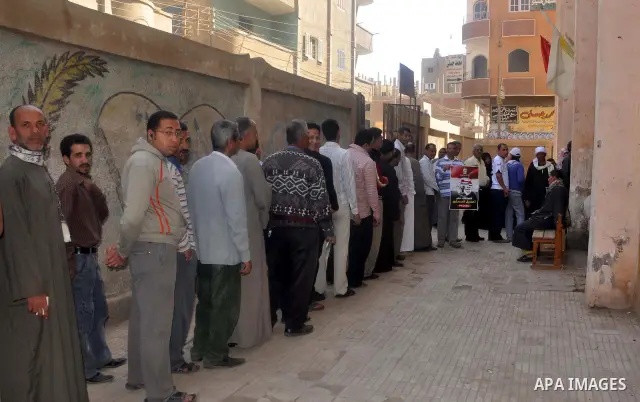 Egyptians queue to cast their vote during a national referendum, at a school in Cairo. Egyptians flocked to the polls on Saturday in a historic referendum on changes to the constitution. The amendments were proposed by a...