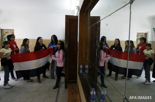Egyptians queue to cast their vote during a national referendum, at a school in Cairo, March 19, 2011. Egyptians flocked to the polls on Saturday in a historic referendum on changes to the constitution. The amendments we...