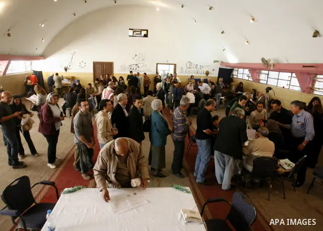 Egyptians queue to cast their vote during a national referendum, at a school in Cairo, March 19, 2011. Egyptians flocked to the polls on Saturday in a historic referendum on changes to the constitution. The amendments we...