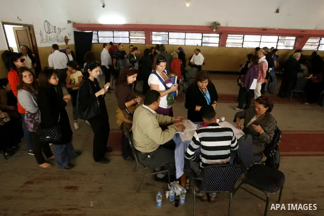 Egyptians queue to cast their vote during a national referendum, at a school in Cairo, March 19, 2011. Egyptians flocked to the polls on Saturday in a historic referendum on changes to the constitution. The amendments we...