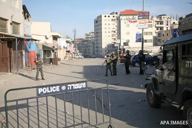 Israeli Border Police fire tear gas towards Palestinian stone throwers during a clash in the Shuafat Refugee Camp, north of Jerusalem, in the West Bank, 19 March 2011. Palestinians clashed with Israeli forces in several...