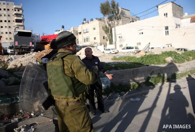 Israeli Border Police fire tear gas towards Palestinian stone throwers during a clash in the Shuafat Refugee Camp, north of Jerusalem, in the West Bank, 19 March 2011. Palestinians clashed with Israeli forces in several...