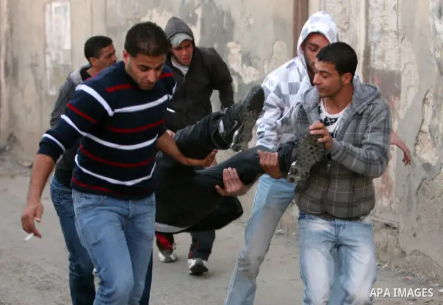 Israeli Border Police fire tear gas towards Palestinian stone throwers during a clash in the Shuafat Refugee Camp, north of Jerusalem, in the West Bank, 19 March 2011. Palestinians clashed with Israeli forces in several...