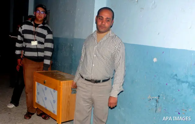 Egyptians open the boxes to announce the results of referendum on constitutional amendments at a school in Cairo, March 19, 2011. Polling stations opened on Saturday in Egypt for a referendum on constitutional amendments...
