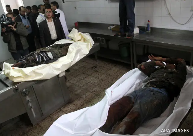 Relatives of Gazsem abu Etwee, 17-years-old and Imad Frajallah also 17, are brought to the morgue at a hospital in Gaza City on March 20, 2011. Palestinian medical officials said they had found the bodies of two men sout...