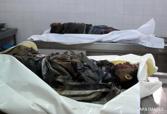 Relatives of Gazsem abu Etwee, 17-years-old and Imad Frajallah also 17, are brought to the morgue at a hospital in Gaza City on March 20, 2011. Palestinian medical officials said they had found the bodies of two men sout...