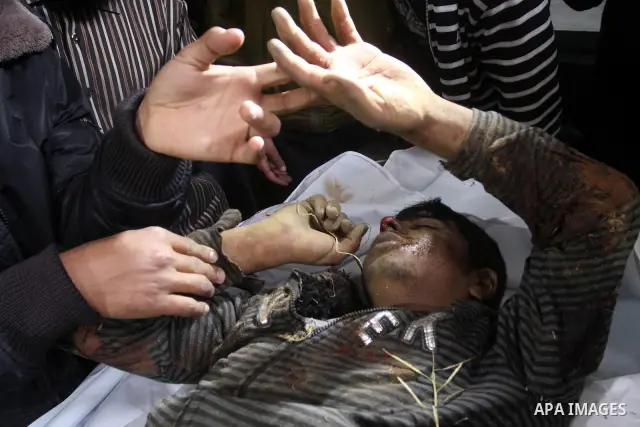 Relatives of Gazsem abu Etwee, 17-years-old and Imad Frajallah also 17, are brought to the morgue at a hospital in Gaza City on March 20, 2011. Palestinian medical officials said they had found the bodies of two men sout...