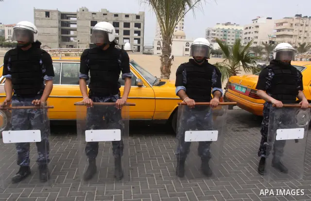 Palestinian riot police participate in a march in Gaza City on March 20, 2011. Photo by Mohammed Asad