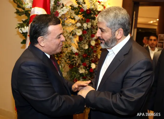 The head of the Hamas political bureau, Khaled Mashaal meets with the Tunisian ambassador in Syria, Mohammed Ouati in Damascus on March 20,2011. Photo by Majd Majd