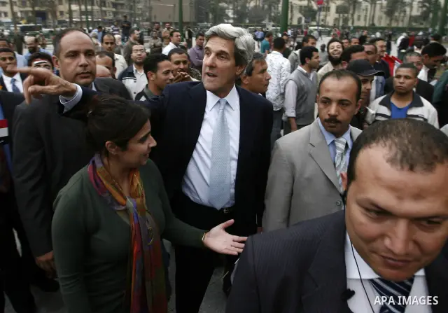 US senator John Kerry greets Egyptians as he visits Tahrir Square, the focal point of Egyptian uprising, in Cairo, Egypt, Sunday, March 20, 2011. Kerry hold talks with Egypt's military rulers, the Supreme Council of the...