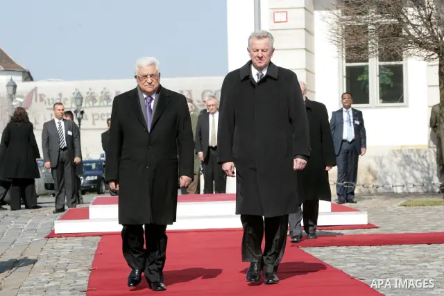 Palestinian President Mahmoud Abbas and Hungarian President Pal Schmitt review an honour guard in front of the presidental palace in Budapest on March 21, 20011 during a welcoming ceremony. The Palestinian National Counc...