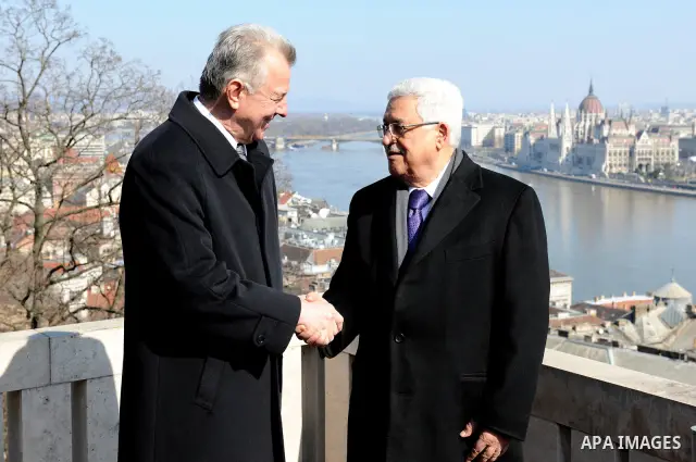 Palestinian President Mahmoud Abbas meets with the Hungarian President Pal Schmitt review an honour guard in front of the presidental palace in Budapest on March 21, 20011. The Palestinian National Council was saddened b...