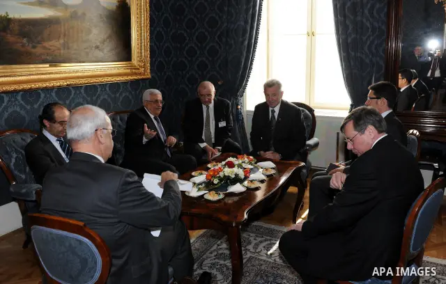 Palestinian President Mahmoud Abbas meets with the Hungarian President Pal Schmitt review an honour guard in front of the presidental palace in Budapest on March 21, 20011. The Palestinian National Council was saddened b...
