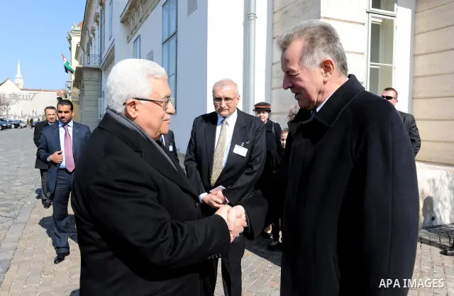 Palestinian President Mahmoud Abbas meets with the Hungarian President Pal Schmitt review an honour guard in front of the presidental palace in Budapest on March 21, 20011. The Palestinian National Council was saddened b...