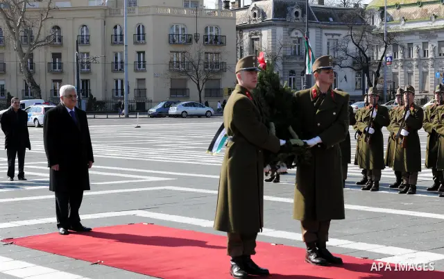 Palestinian President Mahmoud Abbas lays a wreath at the monument of the Unknown Soldier at Heroes Square in Budapest on March 21, 20011. The Palestinian National Council was saddened by the bloodshed in Libya's month-lo...